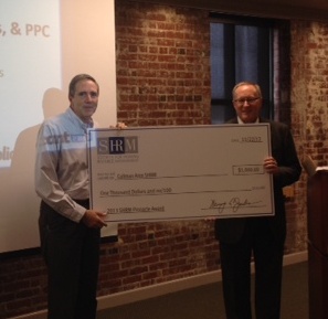 2013 CSHRM President, Jim Yoho, receives the award check from award sponsor, ADP.